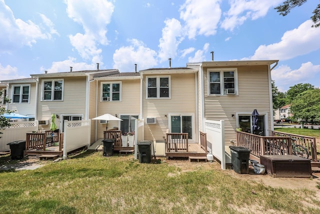 4 Kimberly Dr Unit 4, Merrimack, NH 03054 - rear view of house featuring a deck and a lawn