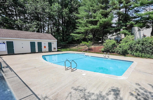 4 Kimberly Dr Unit 4, Merrimack, NH 03054 - community pool featuring a patio and view of wooded area