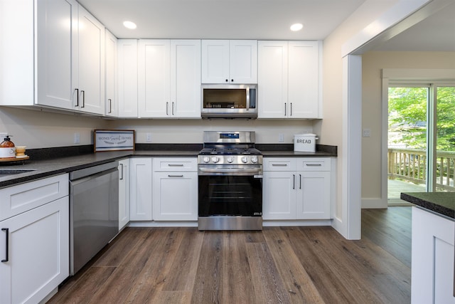 80 Scott Dr, Alton, NH 03810 - kitchen featuring stainless steel appliances, dark wood-style floors, white cabinets, dark countertops, and recessed lighting