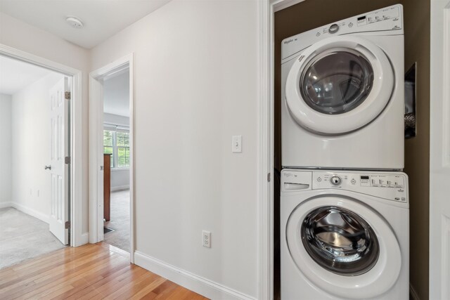 67 Leddy Dr, Epping, NH 03042 - washroom with stacked washer / drying machine, light wood-style floors, and baseboards