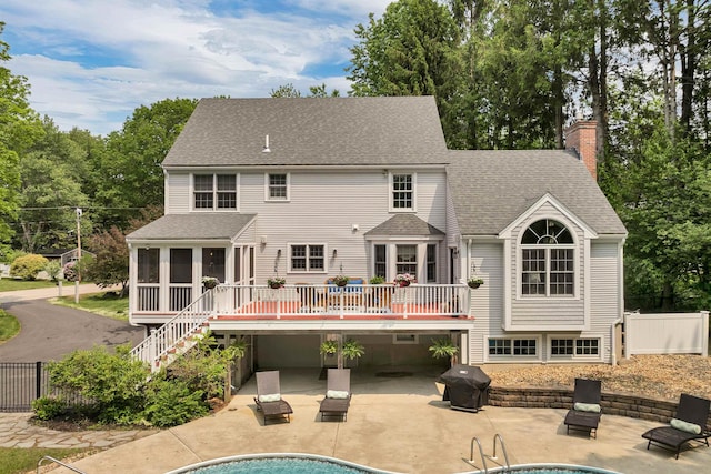12 Ridgewood Ter, Exeter, NH 03833 - rear view of property with stairs, a sunroom, a patio, and a deck