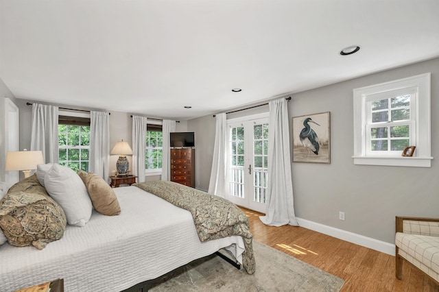 12 Ridgewood Ter, Exeter, NH 03833 - bedroom with baseboards, wood finished floors, access to outside, and recessed lighting