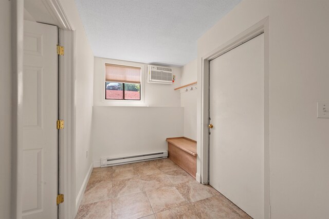 144 Treetop Cir Unit 15, Laconia, NH 03246 - hall featuring baseboard heating and a wall mounted AC