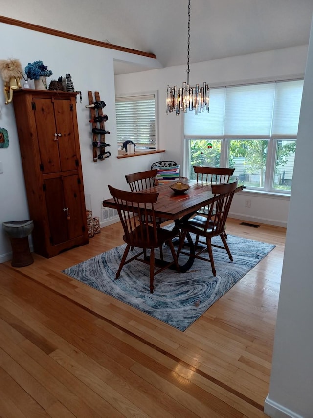 60 Skyline Dr, Keene, NH 03431 - dining area with wood finished floors, healthy amount of natural light, a chandelier, and baseboards