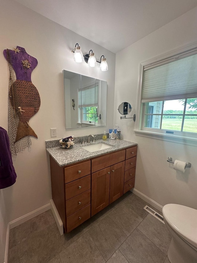 60 Skyline Dr, Keene, NH 03431 - bathroom featuring vanity, toilet, baseboards, and tile patterned flooring