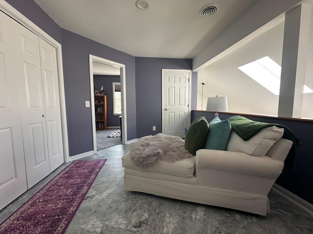 60 Skyline Dr, Keene, NH 03431 - living area with a skylight, a textured ceiling, and baseboards