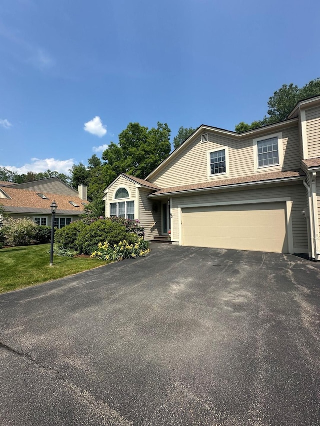 60 Skyline Dr, Keene, NH 03431 - view of front of house with driveway and an attached garage
