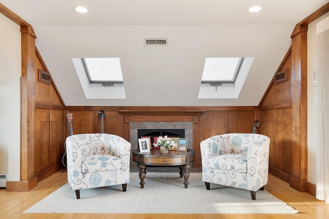 30 Ancient Hwy, Hampton, NH 03842 - sitting room with a skylight, light wood-type flooring, lofted ceiling, baseboard heating, and recessed lighting