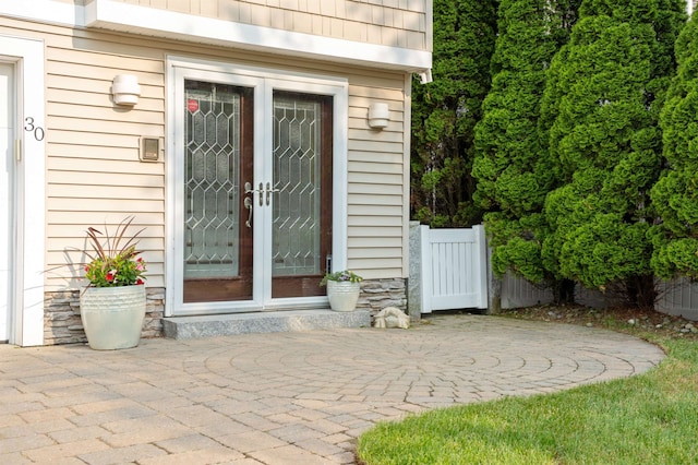 30 Ancient Hwy, Hampton, NH 03842 - property entrance with french doors and a patio