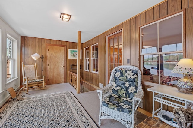 57 Lakeside Rd, Bristol, NH 03222 - sitting room featuring wooden walls, carpet, and a water view