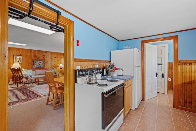 57 Lakeside Rd, Bristol, NH 03222 - kitchen with white appliances, wooden walls, wainscoting, crown molding, and light tile patterned floors