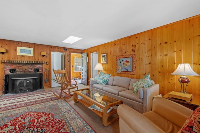 57 Lakeside Rd, Bristol, NH 03222 - carpeted living room with a skylight and wood walls