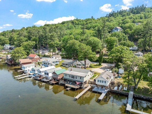 57 Lakeside Rd, Bristol, NH 03222 - aerial perspective of suburban area featuring a forest and a large body of water