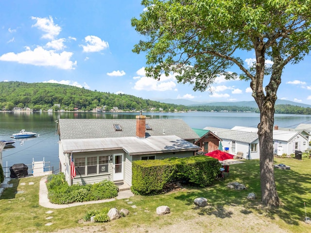57 Lakeside Rd, Bristol, NH 03222 - water view with a heavily wooded area