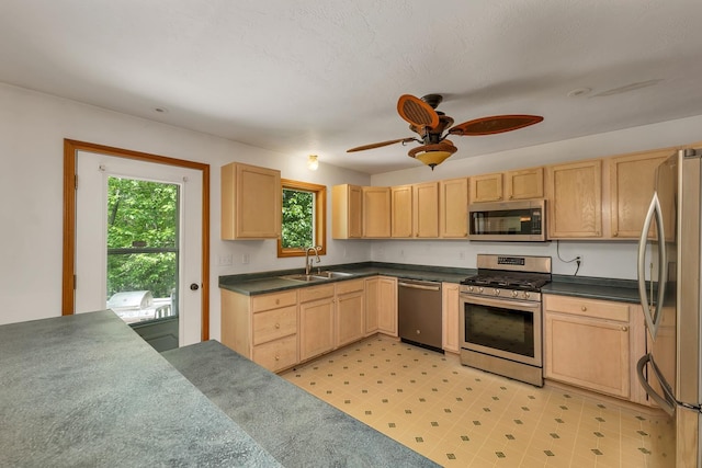 161 Frank C Gilman Hwy, Alton, NH 03809 - kitchen featuring stainless steel appliances, a sink, and light brown cabinetry