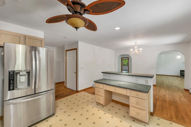 161 Frank C Gilman Hwy, Alton, NH 03809 - kitchen with stainless steel fridge with ice dispenser, arched walkways, dark countertops, a ceiling fan, and baseboards