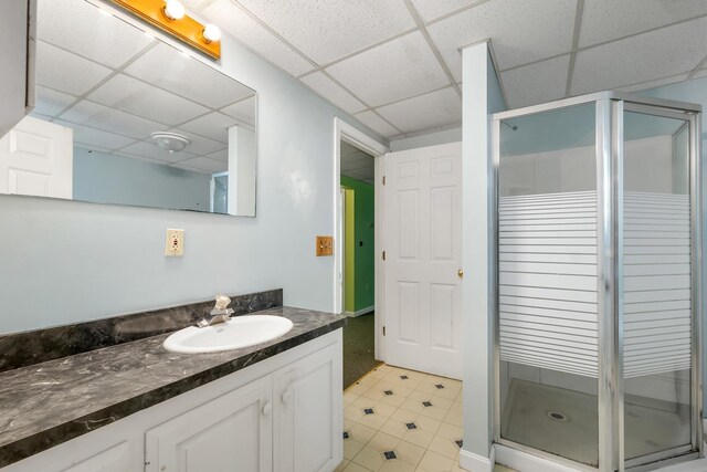 161 Frank C Gilman Hwy, Alton, NH 03809 - bathroom with a drop ceiling, vanity, a shower stall, and tile patterned floors