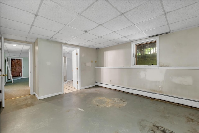 161 Frank C Gilman Hwy, Alton, NH 03809 - basement featuring a drop ceiling, a baseboard radiator, and baseboards