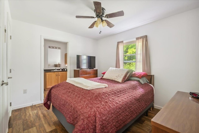 4611 W Berkshire Rd, Enosburg, VT 05450 - bedroom featuring dark wood-style flooring, baseboards, ensuite bath, and a ceiling fan