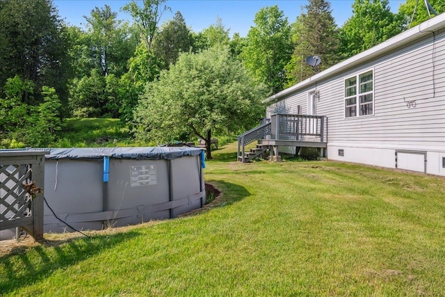 4611 W Berkshire Rd, Enosburg, VT 05450 - view of green lawn featuring a wooden deck and a covered pool