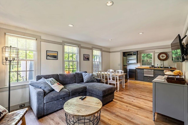 4780 Mountain Rd, Stowe, VT 05672 - living room featuring light wood-style flooring, bar area, and recessed lighting