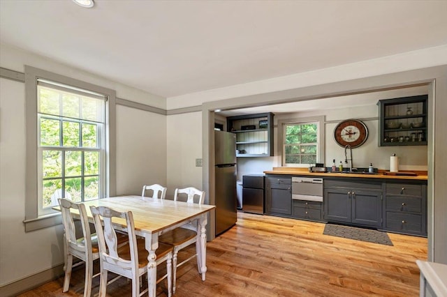 4780 Mountain Rd, Stowe, VT 05672 - dining area featuring wet bar and light wood finished floors