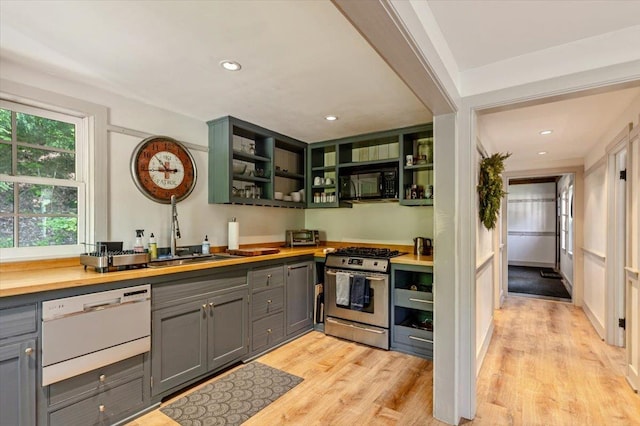 4780 Mountain Rd, Stowe, VT 05672 - kitchen featuring stainless steel gas range oven, gray cabinets, black microwave, open shelves, and recessed lighting