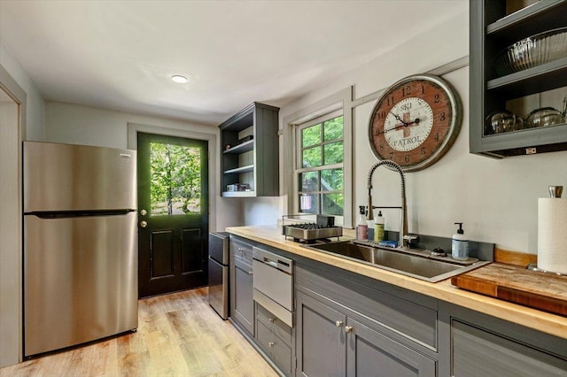 4780 Mountain Rd, Stowe, VT 05672 - kitchen featuring freestanding refrigerator, a sink, open shelves, and healthy amount of natural light