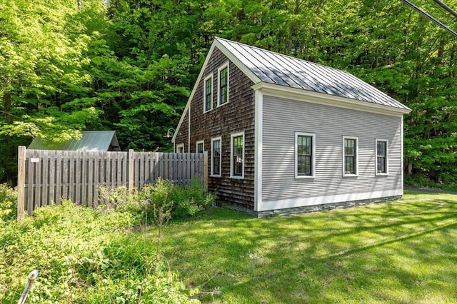 4780 Mountain Rd, Stowe, VT 05672 - view of property exterior with a standing seam roof, metal roof, and a forest view