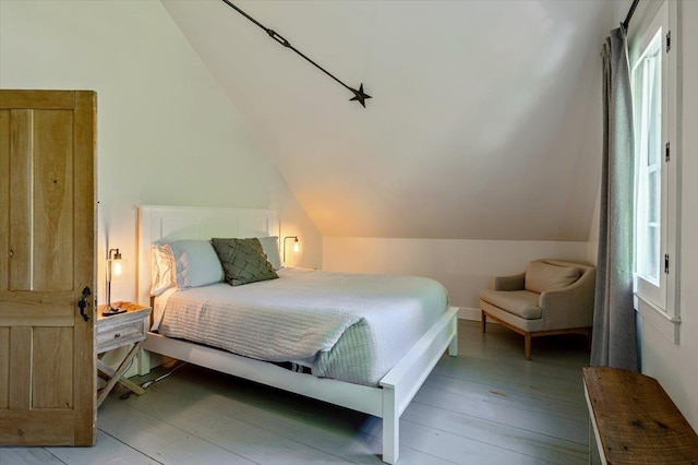 4780 Mountain Rd, Stowe, VT 05672 - bedroom with light wood-style flooring and lofted ceiling