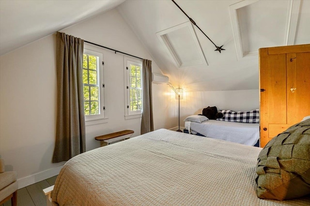 4780 Mountain Rd, Stowe, VT 05672 - bedroom with attic access, lofted ceiling, wood finished floors, and baseboards