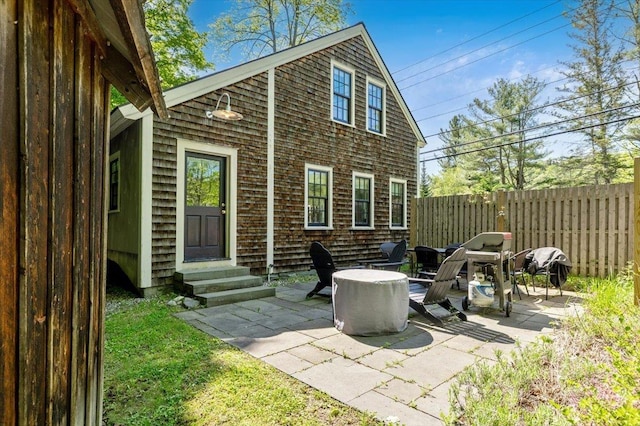 4780 Mountain Rd, Stowe, VT 05672 - rear view of property with entry steps and a patio