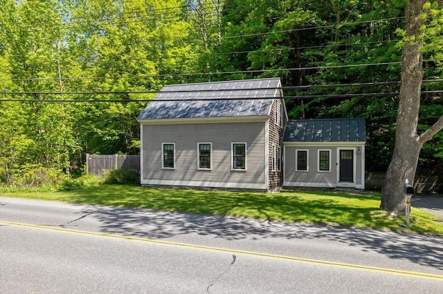 4780 Mountain Rd, Stowe, VT 05672 - view of front of house with a standing seam roof and metal roof