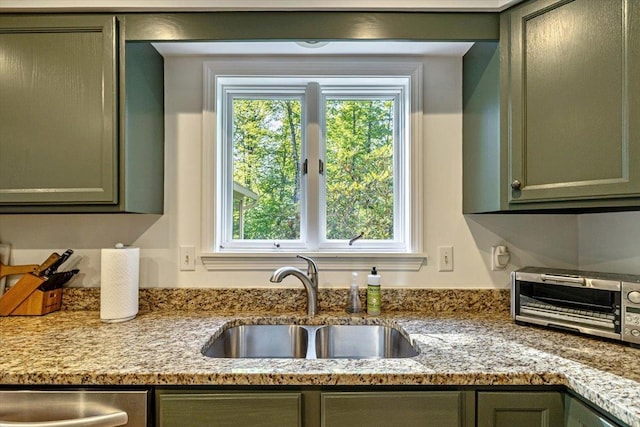 165 Golf Course Rd, Warren, VT 05674 - kitchen featuring a sink, green cabinetry, and light stone countertops