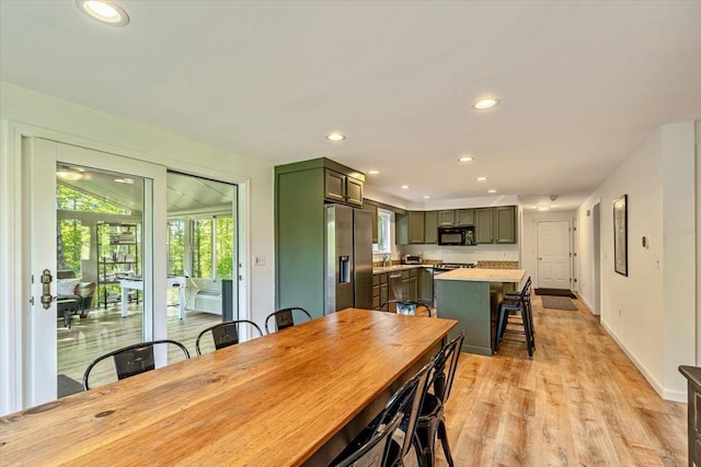 165 Golf Course Rd, Warren, VT 05674 - dining room with recessed lighting, light wood-style floors, and baseboards