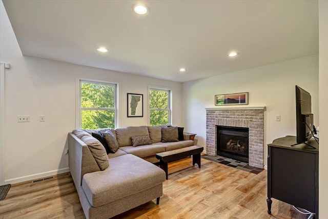 165 Golf Course Rd, Warren, VT 05674 - living room featuring recessed lighting, light wood finished floors, baseboards, and a brick fireplace