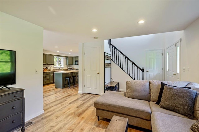 165 Golf Course Rd, Warren, VT 05674 - living room featuring light wood finished floors, stairs, recessed lighting, and baseboards