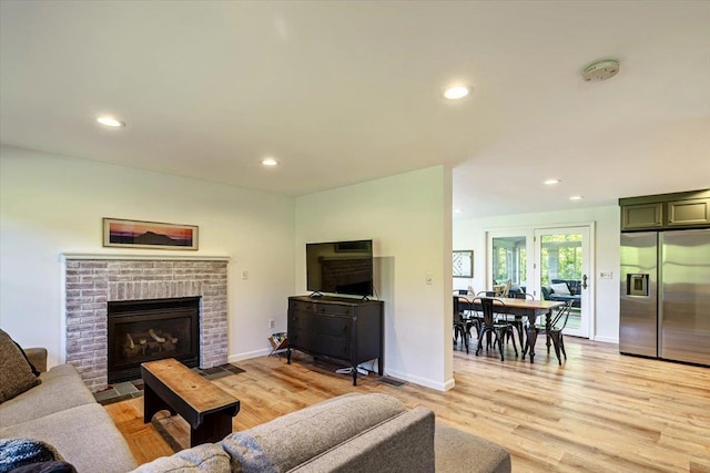 165 Golf Course Rd, Warren, VT 05674 - living room with light wood finished floors, recessed lighting, baseboards, and a brick fireplace