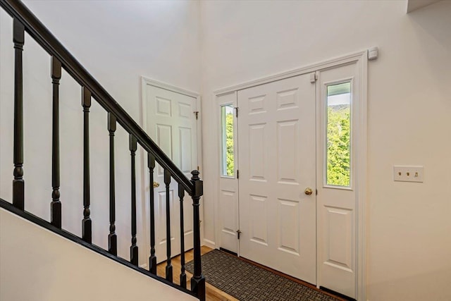 165 Golf Course Rd, Warren, VT 05674 - foyer entrance with stairway, wood finished floors, and baseboards