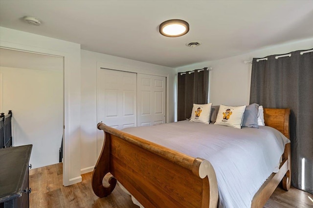165 Golf Course Rd, Warren, VT 05674 - bedroom featuring wood finished floors, a closet, and baseboards