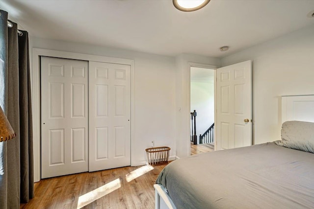 165 Golf Course Rd, Warren, VT 05674 - bedroom featuring light wood finished floors and a closet