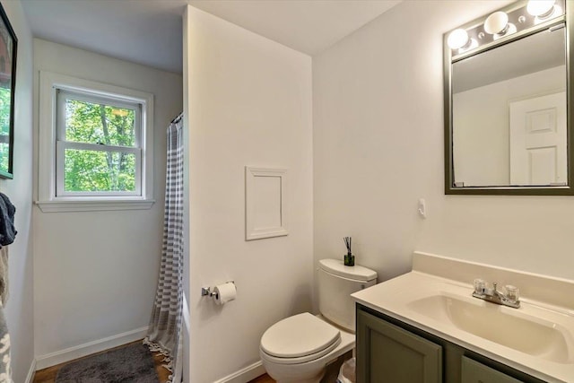 165 Golf Course Rd, Warren, VT 05674 - full bath featuring vanity, toilet, baseboards, and a shower with shower curtain