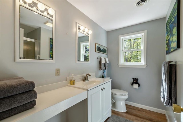 165 Golf Course Rd, Warren, VT 05674 - full bath with toilet, vanity, a shower with door, wood finished floors, and baseboards