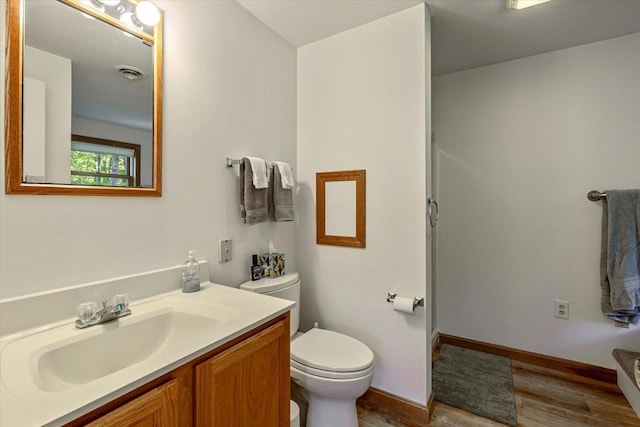 165 Golf Course Rd, Warren, VT 05674 - full bathroom featuring toilet, wood finished floors, vanity, and baseboards