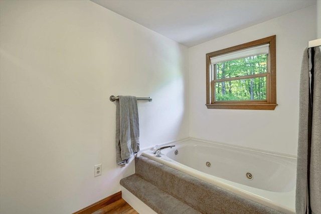 165 Golf Course Rd, Warren, VT 05674 - full bath featuring a whirlpool tub and wood finished floors