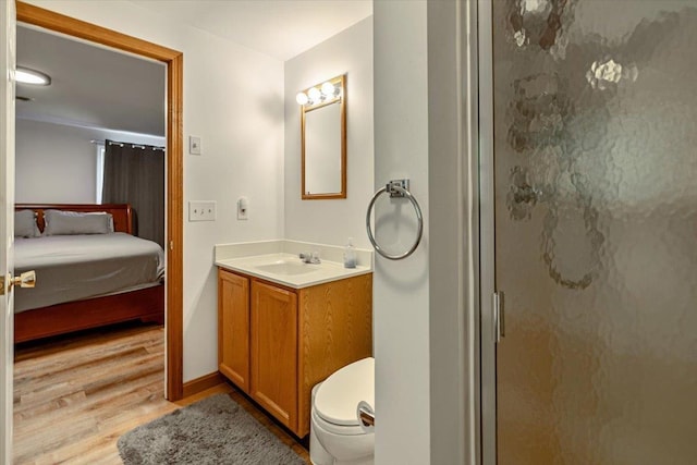 165 Golf Course Rd, Warren, VT 05674 - ensuite bathroom featuring wood finished floors, vanity, a stall shower, and toilet