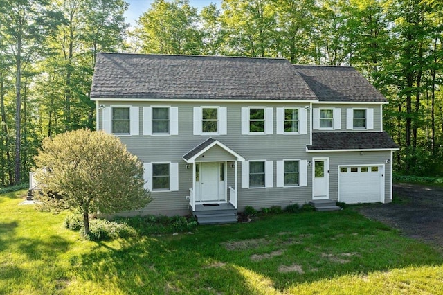 165 Golf Course Rd, Warren, VT 05674 - colonial house with an attached garage, a front yard, asphalt driveway, and a shingled roof