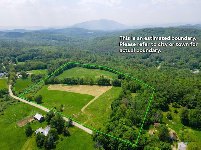 402 E Rd, Cornish, NH 03745 - aerial view of sparsely populated area featuring a heavily wooded area, property parcel outlined, and a mountainous background