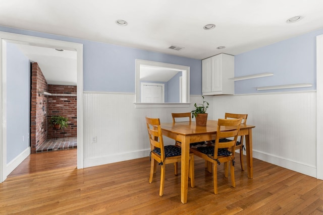 20 Circuit Dr, Kingston, NH 03848 - dining room featuring a wainscoted wall, light wood-style flooring, and baseboards
