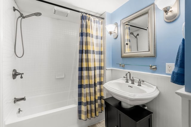 20 Circuit Dr, Kingston, NH 03848 - bathroom featuring shower / bathtub combination with curtain, a wainscoted wall, and vanity